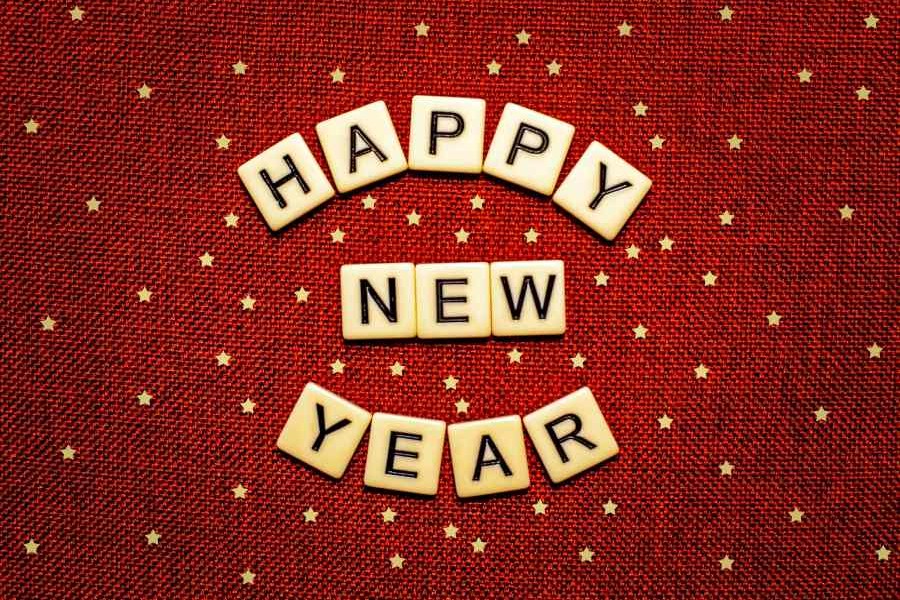 Happy New Year spelled out in Scrabble tiles